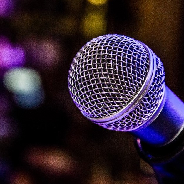 A microphone on a background of blurred lights
